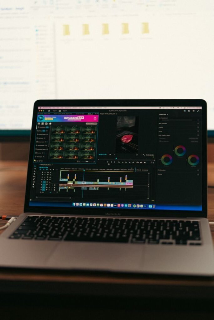A laptop displaying video editing software, perfect for media professionals.